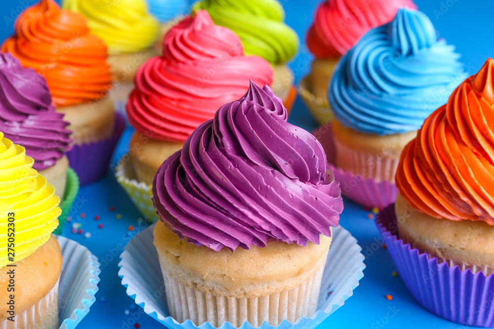 Sweet tasty cupcakes on color background Sweet tasty cupcakes on color background