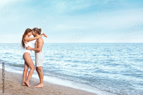Happy young couple at sea r...