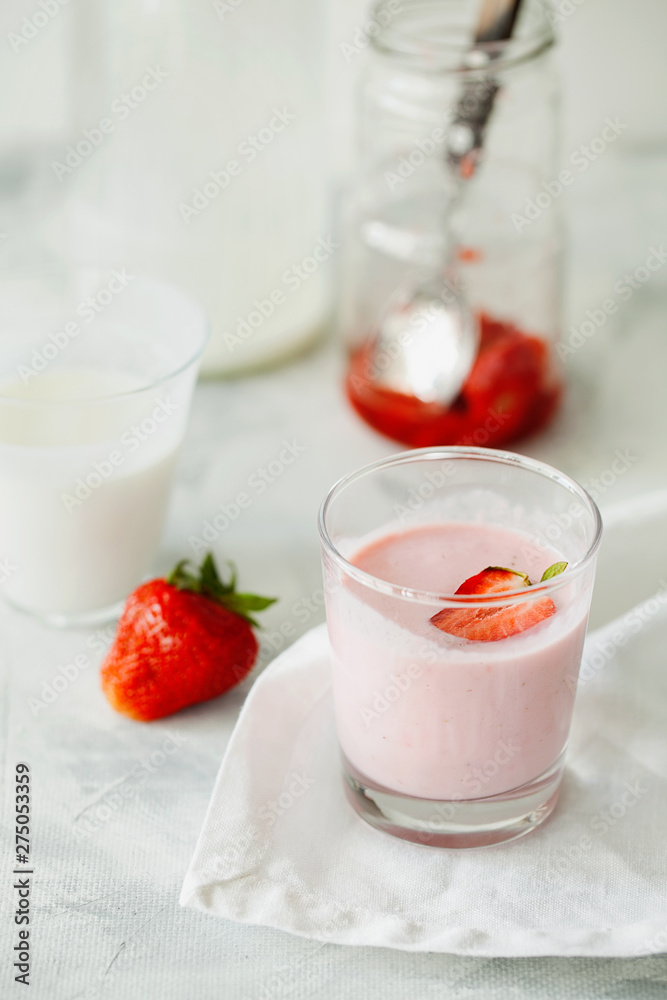 Homemade organic fresh raspberry smoothie with fermented kefir(yogurt,ayran,lassi,milky product) for dieting breakfast in glass on white background.Summer healthy fruit drink.Vertical orientation Homemade organic fresh raspberry smoothie with fermented kefir(yogurt,ayran,lassi,milky product) for dieting breakfast in glass on white background.Summer healthy fruit drink.Vertical orientation