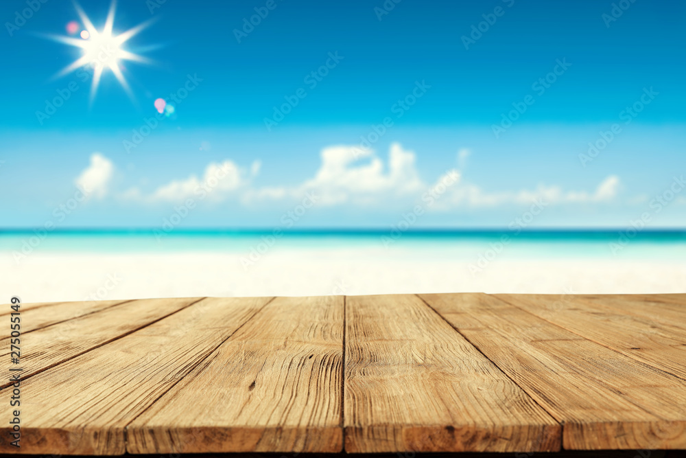 Desk of free space and summer beach background Desk of free space and summer beach background