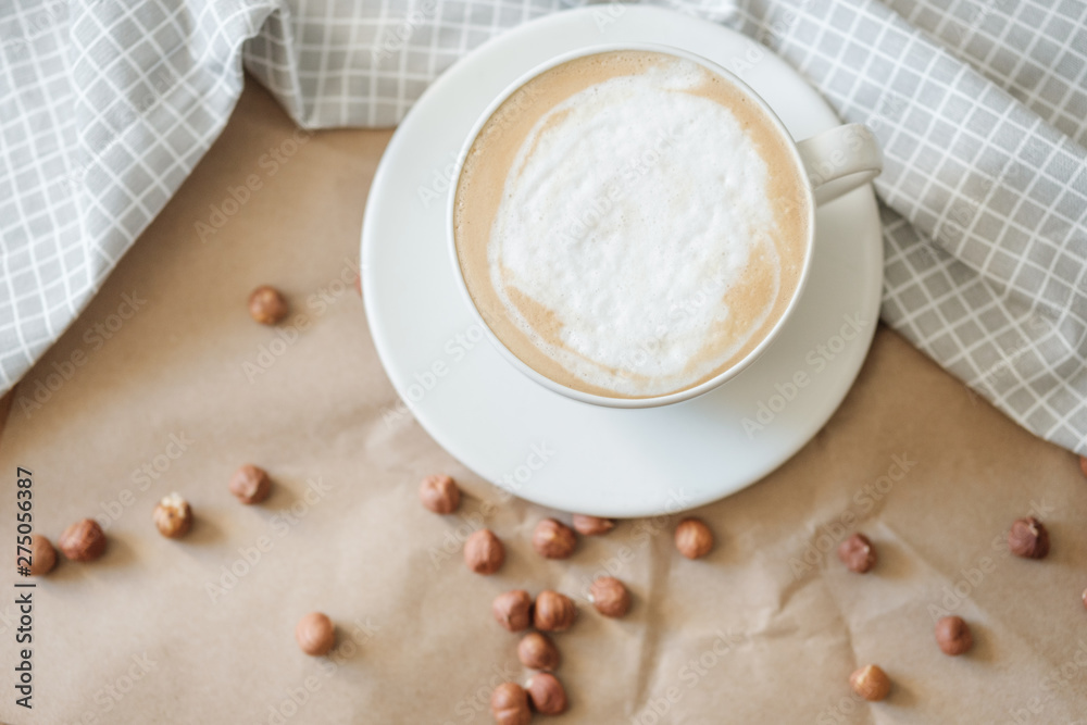 hot morning coffee and nuts on craft paper hot morning coffee and nuts on craft paper