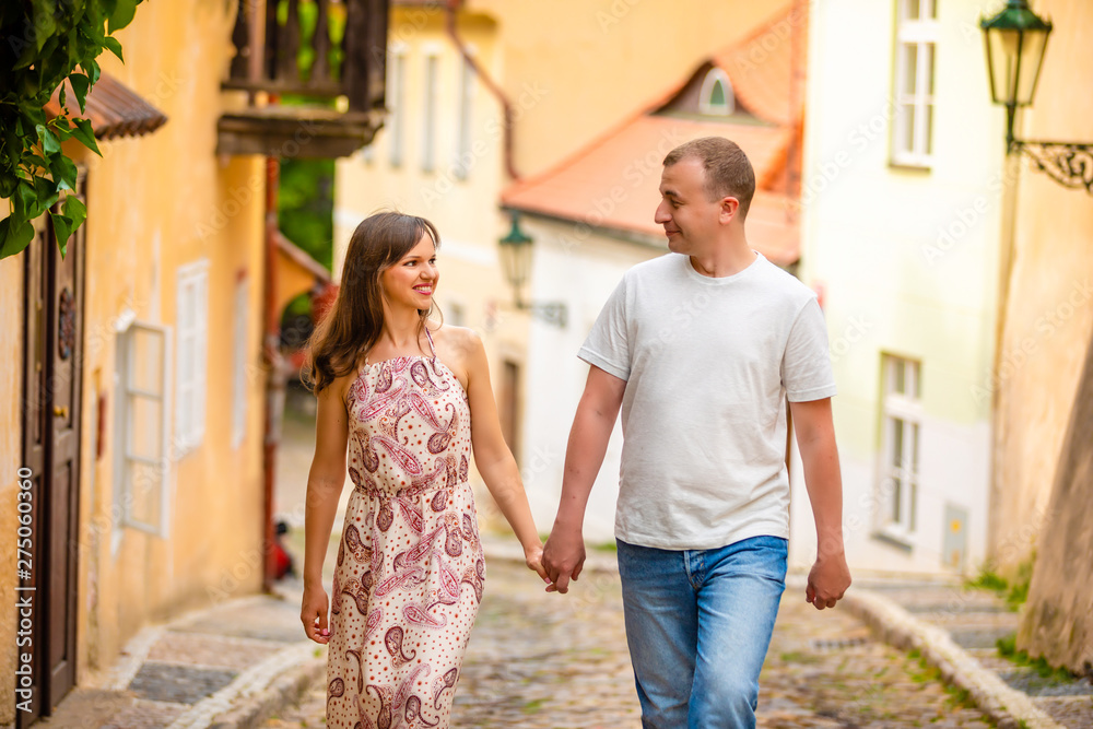 Naklejka premium Young couple walking in old town of Prague