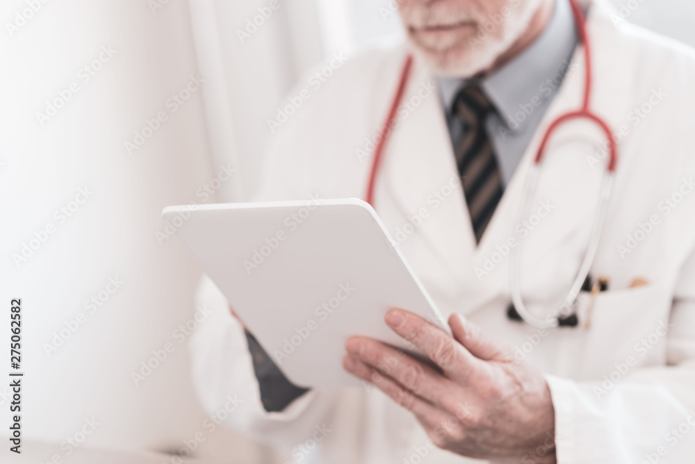 Male doctor using digital tablet Male doctor using digital tablet