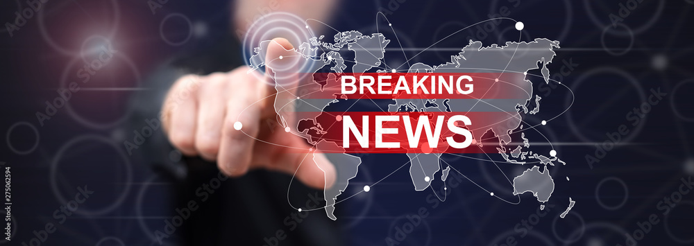 Man touching a breaking news concept Man touching a breaking news concept