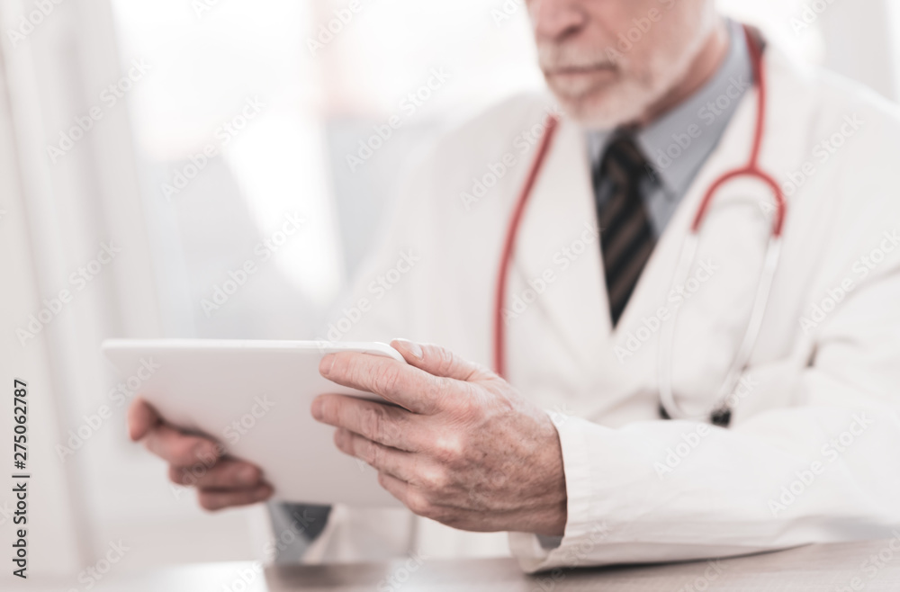 Male doctor using digital tablet Male doctor using digital tablet
