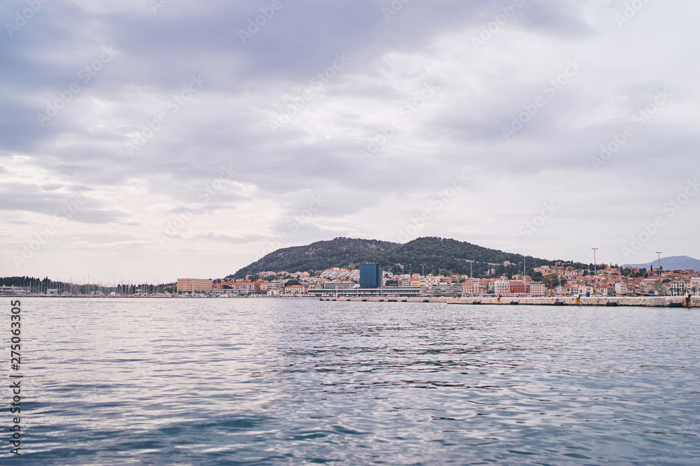 Travel by Croatia. Beautiful landscape with Split Old Town and sea promenade.