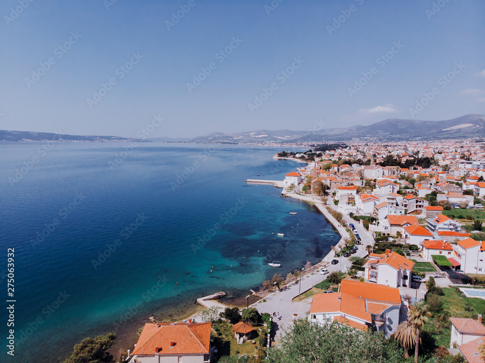 Aerial shot of the Kastel coast in Dalmatia,Croatia . A famous tourist destination. Old town near on the Adriatic sea.