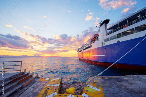 Travel by Greece. Beautiful sunset landscape with big ferry and sea wharf. photo