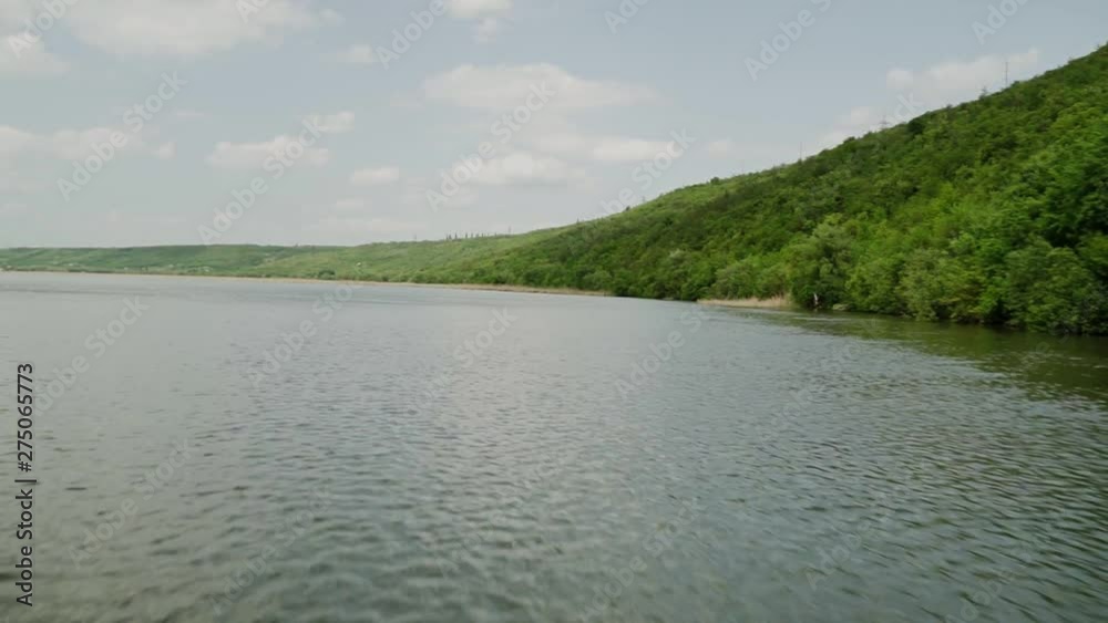 View from the motorboat on the river in motion View from the motorboat on the river in motion