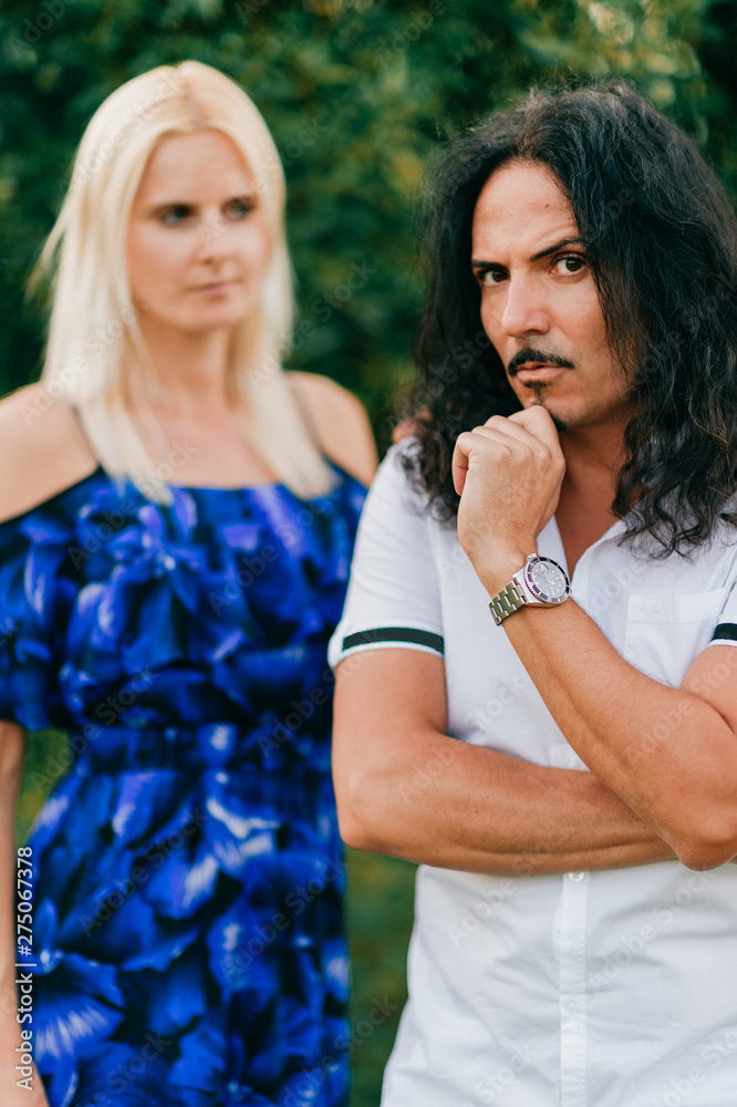 Confident italian man with his caucasian girlfriend outdoor portrait Confident italian man with his caucasian girlfriend outdoor portrait