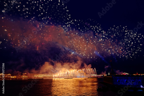 Fireworks over the water Holiday light. Night cityscape scene. Neva river  Saint-Petersburg  Russia. Holiday Scarlet Sails.
