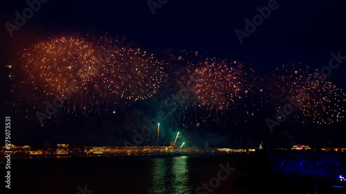 Fireworks over the water Holiday light. Night cityscape scene. Neva river  Saint-Petersburg  Russia. Holiday Scarlet Sails.