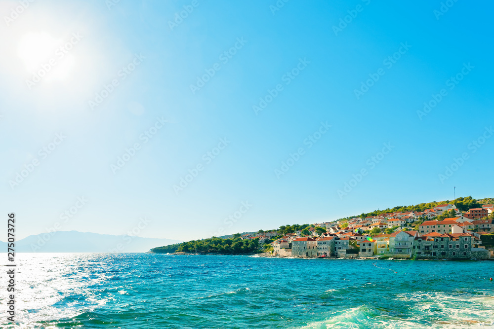 Panoramic view on one of many harbors of a small town Postira - Croatia, island Brac