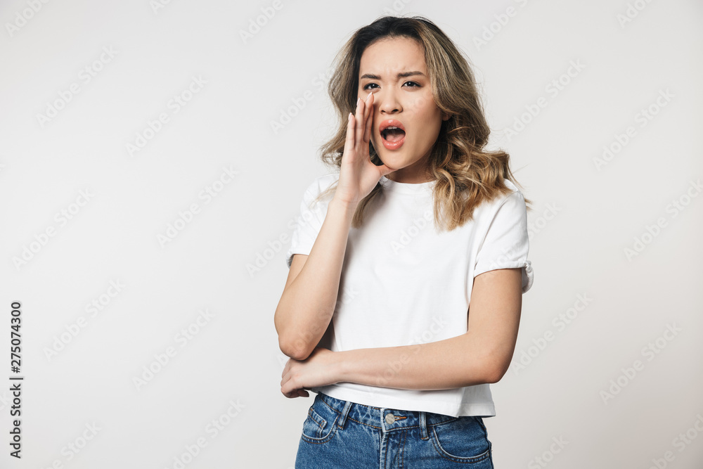Portrait of a lovely young asian woman standing isolated Portrait of a lovely young asian woman standing isolated
