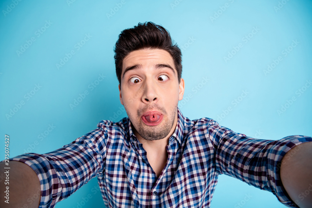 Closeup photo studio portrait of strange stupid crazy silly weird he him  guy holding web cam having video call free time isolated pastel background  Photos | Adobe Stock