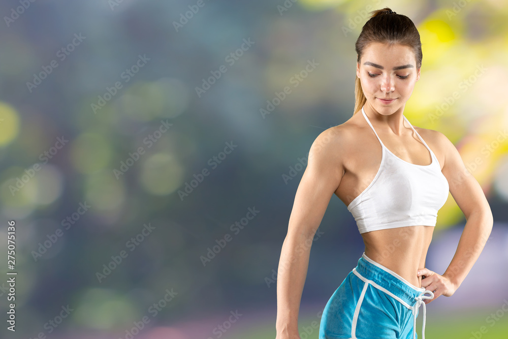 Fitness woman. Young sporty Caucasian female model isolated