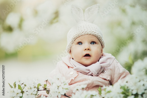Tablou pe pânză a little girl dressed up as a bunny in flowers, Easter