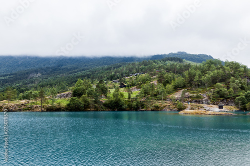 Green mountain landscape with blue idyllic lake