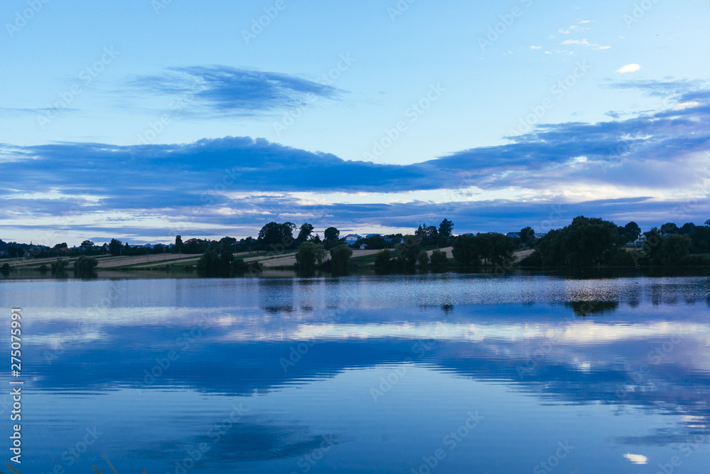 Reflection of sky over the idyllic lake