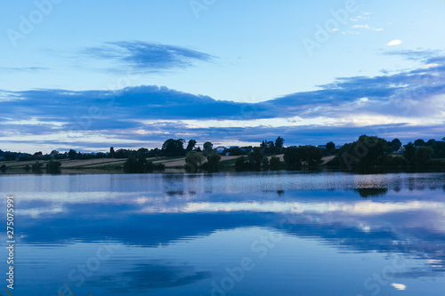 Reflection of sky over the idyllic lake © Freepik