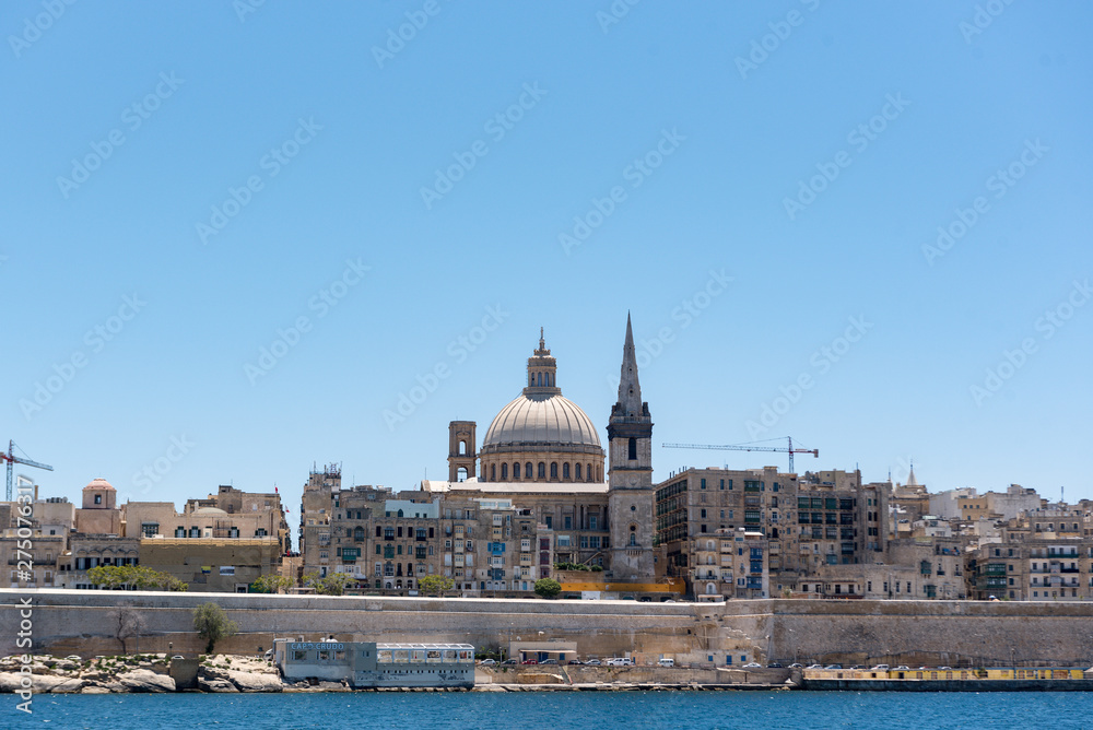 Beautiful Valletta skyline under blue sky, Valletta to Sliema Ferry, viewed from Manoel Island across Marsamxett Harbour. Valletta, Capital city of Malta, November 2019