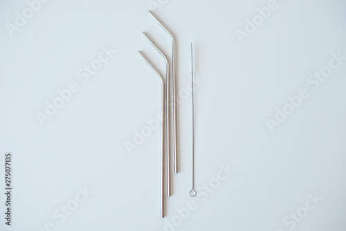 Lot of metal tubes for cocktails with schutkoy for cleaning isolated on white