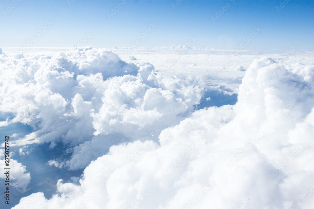 Fototapeta premium Clouds and sky from airplane window view