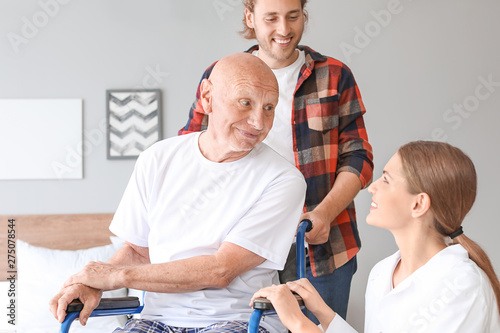 Young man visiting his fath...