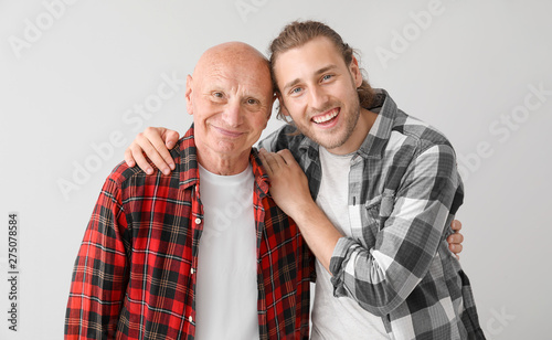 Elderly man with his son on...