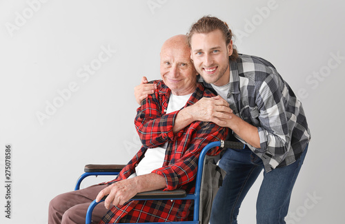 Elderly man with his son on...