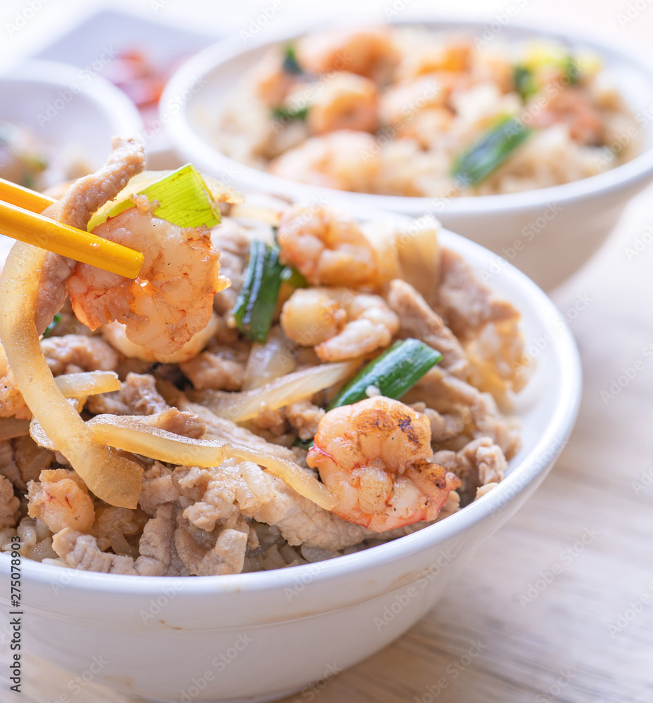 Braised shrimp over rice - Taiwan famous traditional street food. Soy-stewed prawn and sliced pork on cooked rice. Travel concept, copy space, close up Braised shrimp over rice - Taiwan famous traditional street food. Soy-stewed prawn and sliced pork on cooked rice. Travel concept, copy space, close up