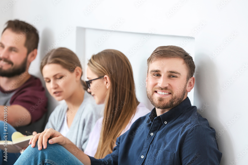 Young man at group therapy session