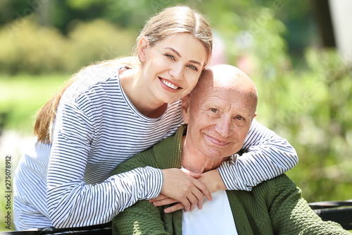 Elderly man with his daught...