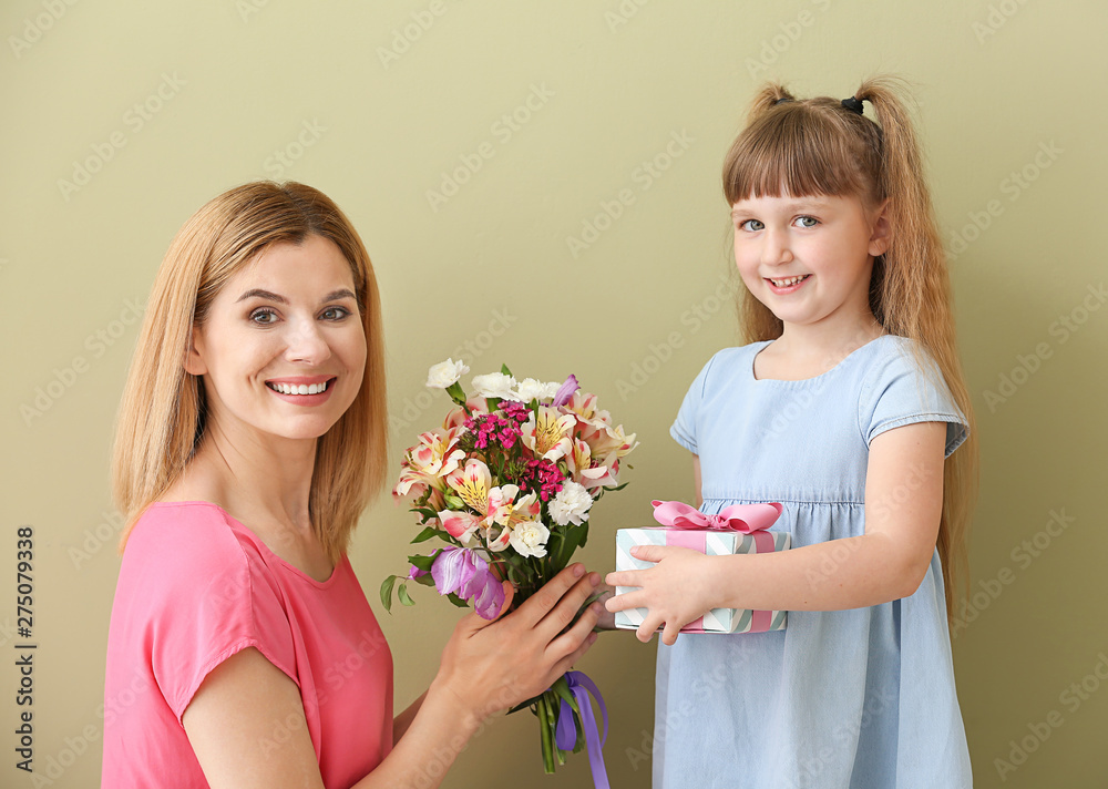 Little girl greeting her mother on color background Little girl greeting her mother on color background
