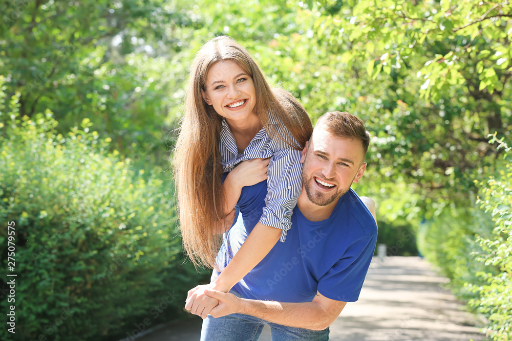 Happy young couple in park on summer day Happy young couple in park on summer day