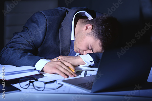 Tired businessman sleeping ...