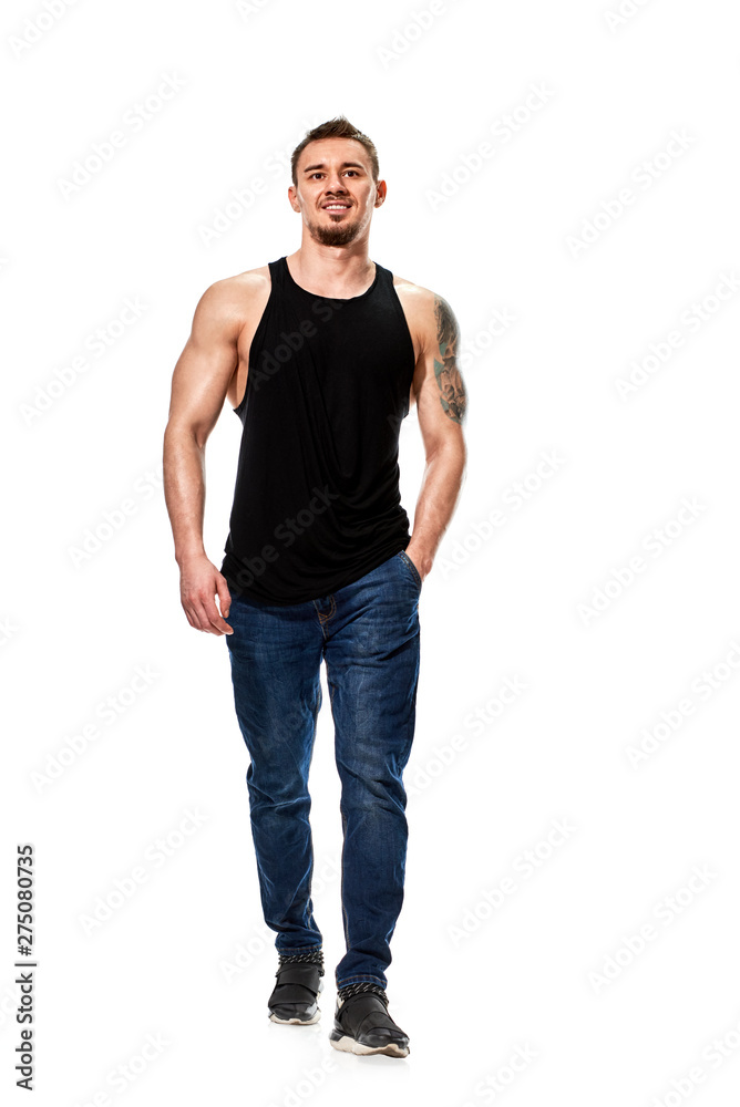 Fototapeta premium Portrait of strong athletic young man in black t-shirt