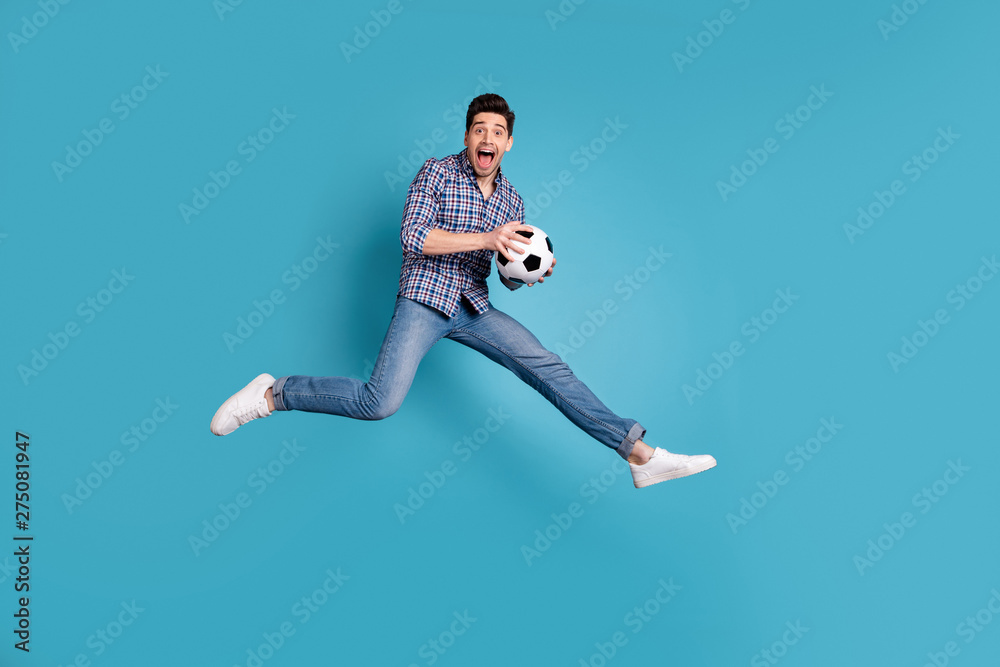 Full length body size view photo of shocked funky funny youth hold hand shout rejoice enjoy energy wear fashionable millennial denim plaid jeans shirt outfit isolated on blue background