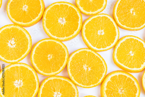 Fresh bright round orange slices. Shades of orange. Flat lay  top view  bright design. Fruit composition. Concept of vitamin C  healthy wholesome food.