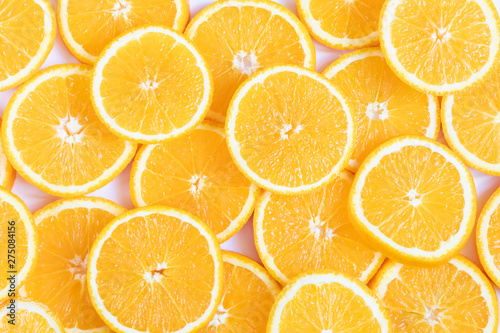 Fresh bright round orange slices. Shades of orange. Flat lay  top view  bright design. Fruit composition. Concept of vitamin C  healthy wholesome food.