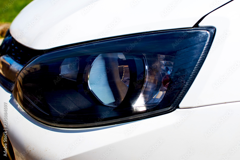 Close up detail of headlights of modern car.