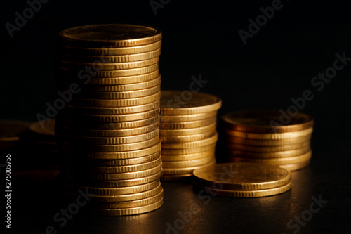 Stack of Gold Coin on Black Background.