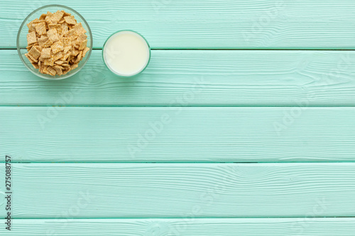 Cereals and flakes from corn and oat on mint wooden background top view mockup