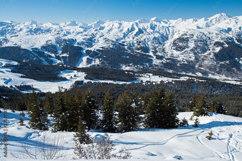Fototapeta premium Panoramic view across snow covered alpine mountain range