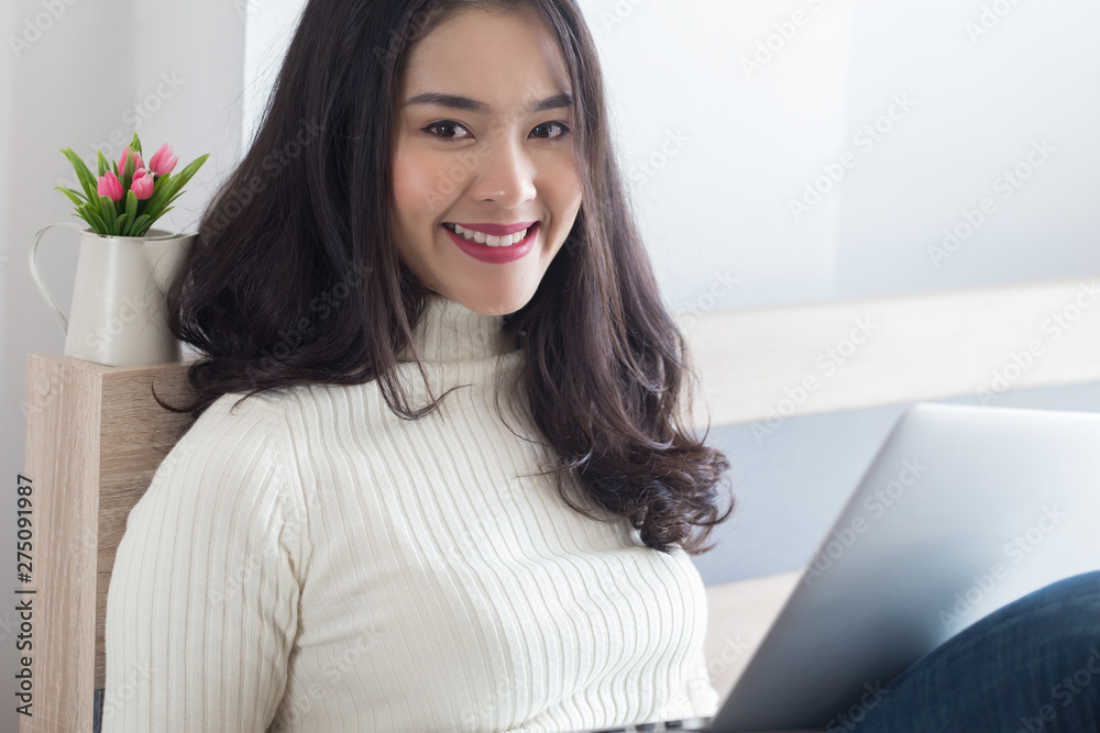 Young beauty Asian woman using computer at home. Young beauty Asian woman using computer at home.