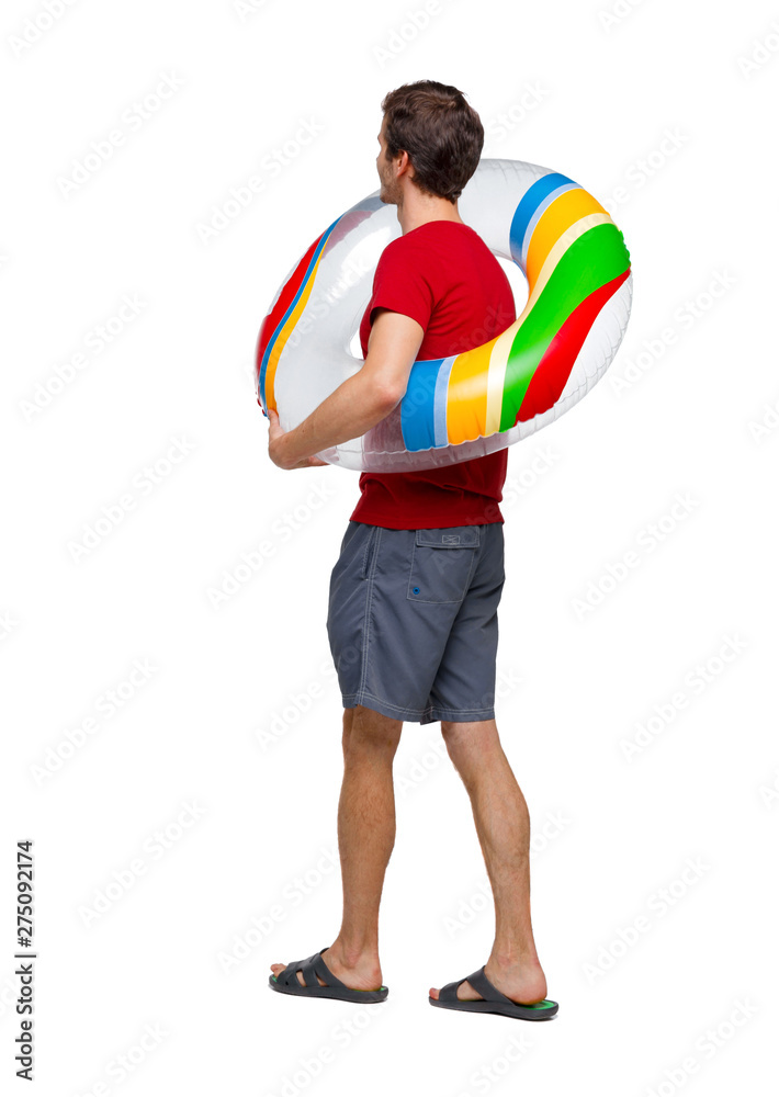 Side view of man with a beach bag that goes to side.