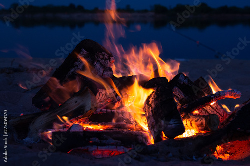 Fire at night. Fire in nature. Blurred backgrounds. Space views.