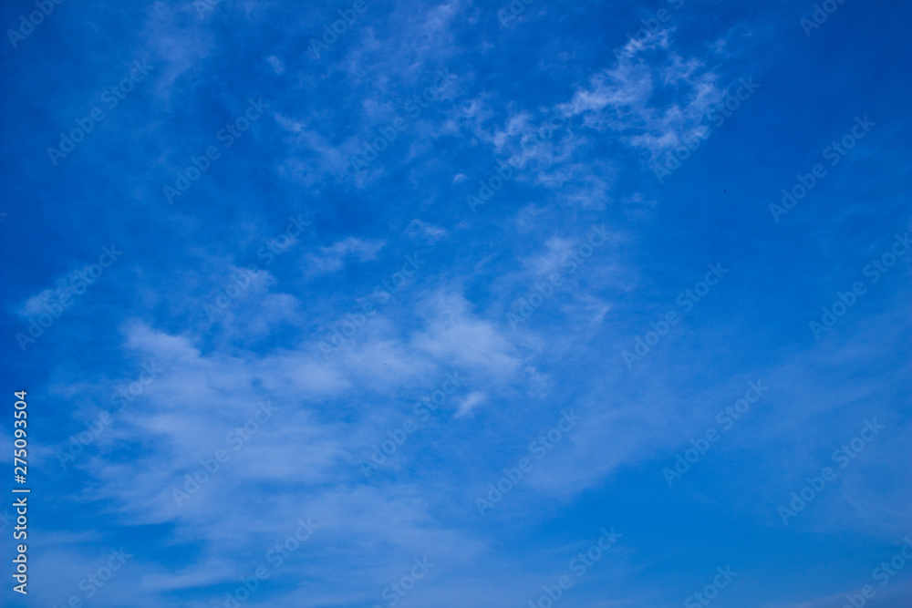 Fototapeta premium Blue sky with cirrus clouds on a summer day. Summer in Russia.