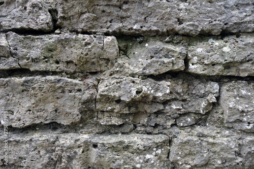 Old grey color grungy brick wall texture.