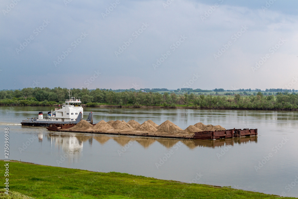 sand barge on the river